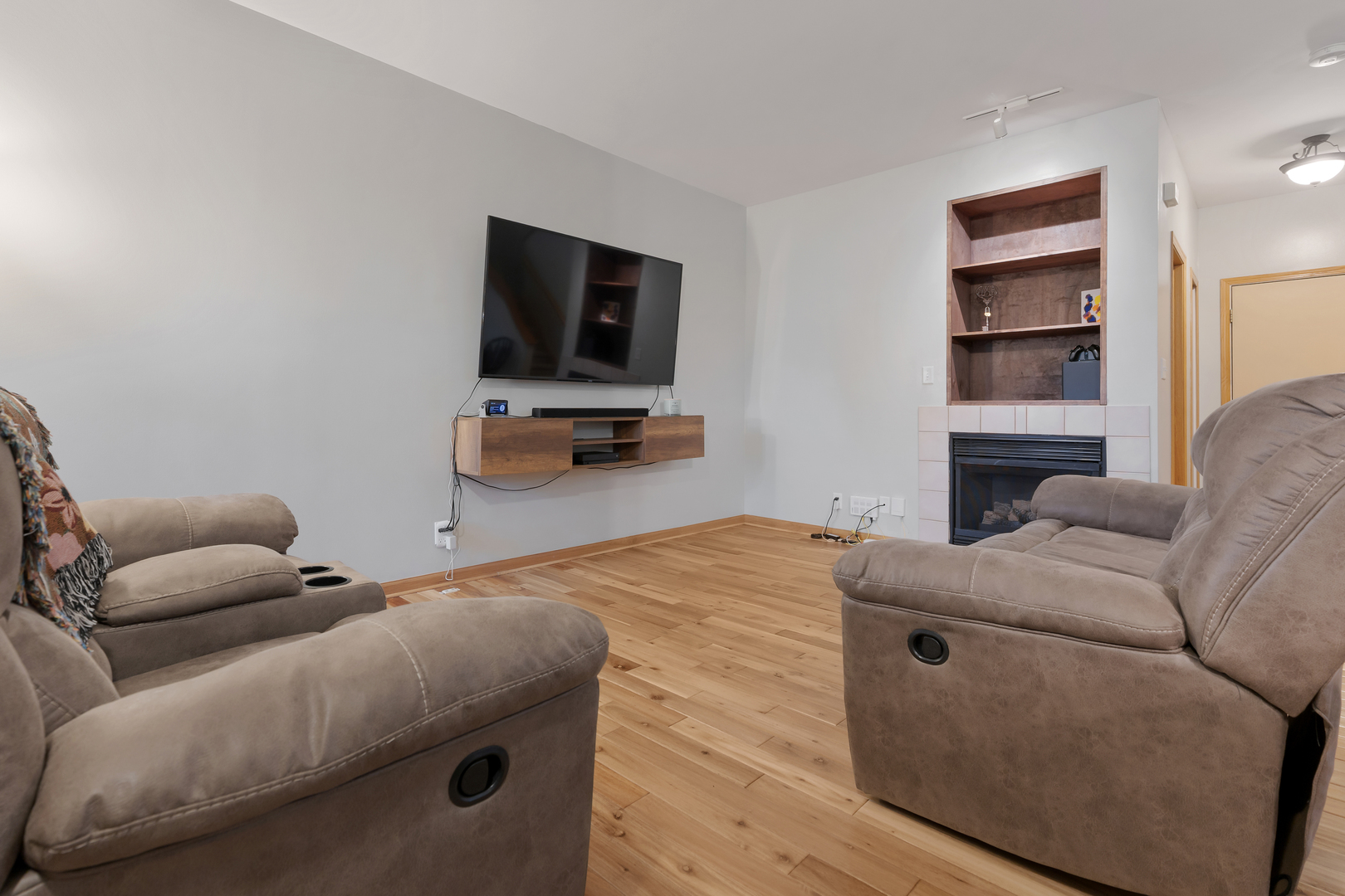 516 Clayton Circle, Unit 516 Sycamore, IL 60178 - Photo 6 of 26 a living room with furniture and a flat screen tv
