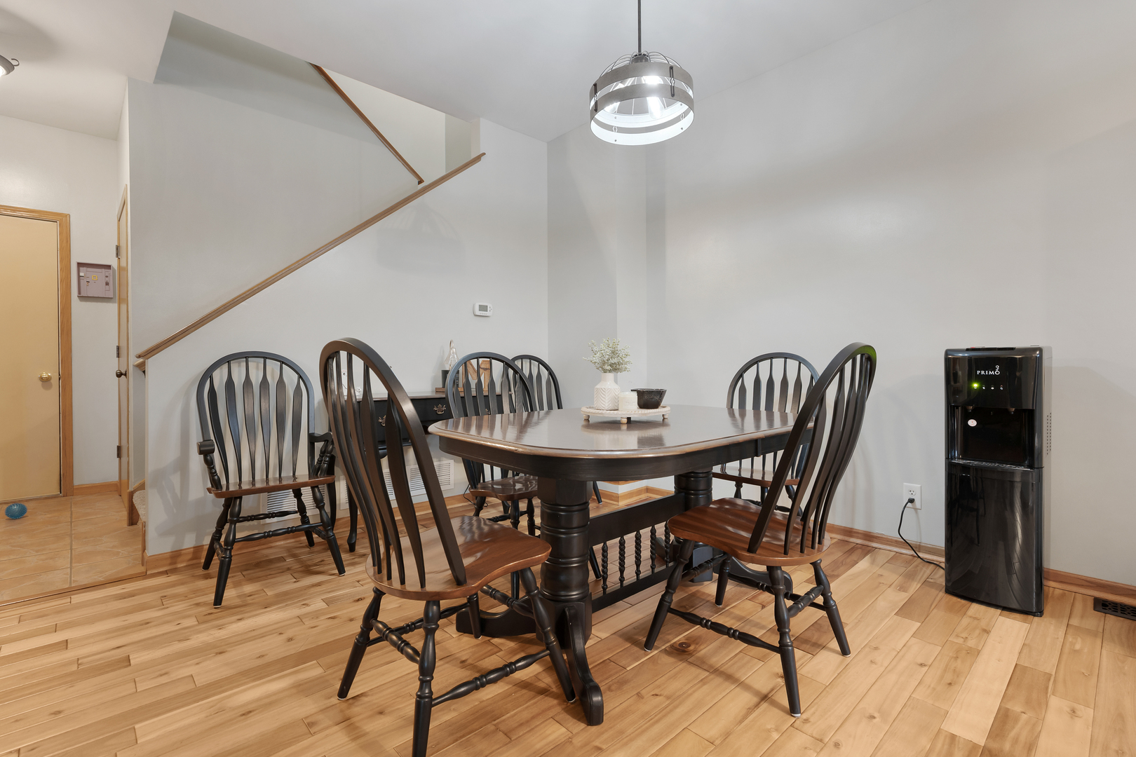 516 Clayton Circle, Unit 516 Sycamore, IL 60178 - Photo 7 of 26 a view of a dining room with furniture wooden floor and chandelier