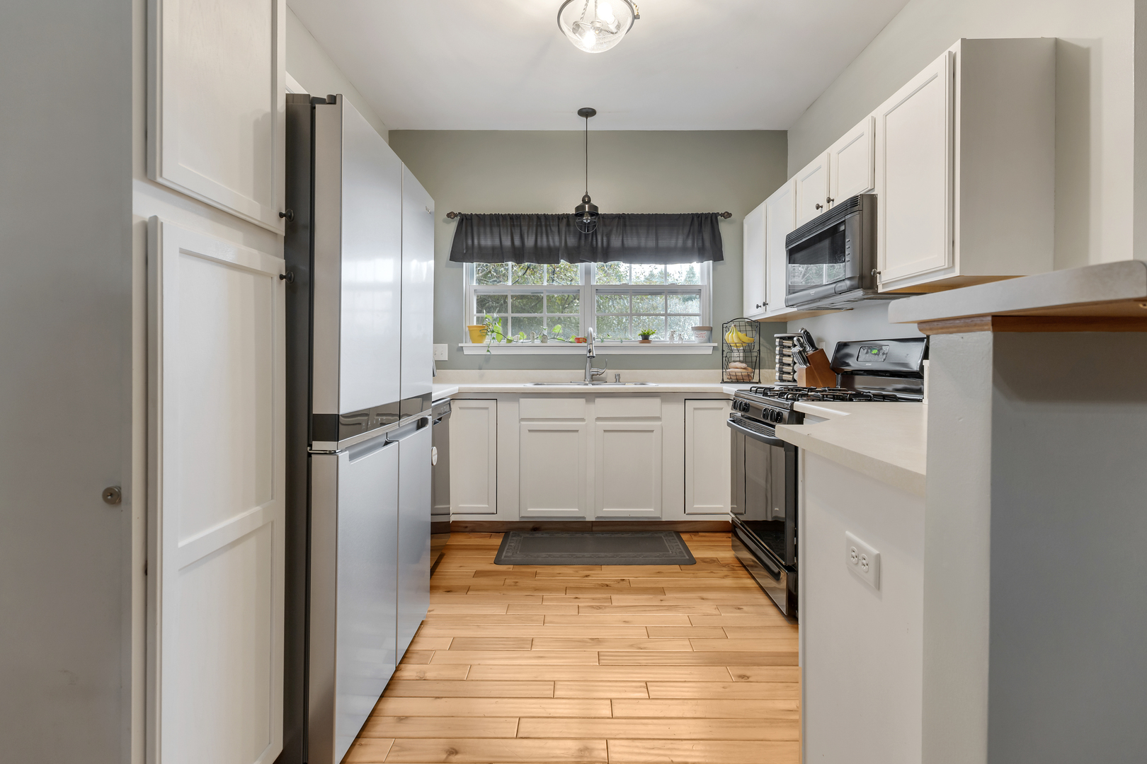 516 Clayton Circle, Unit 516 Sycamore, IL 60178 - Photo 9 of 26 a kitchen with stainless steel appliances granite countertop a refrigerator and a stove top oven