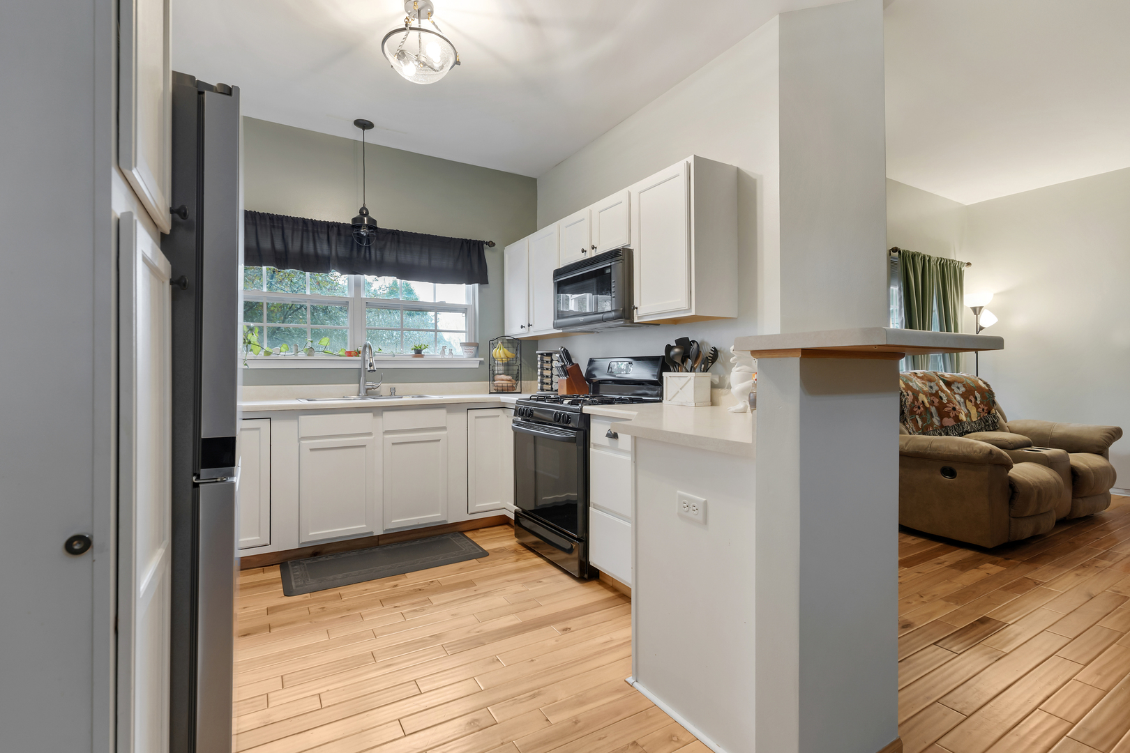 516 Clayton Circle, Unit 516 Sycamore, IL 60178 - Photo 10 of 26 a kitchen with white cabinets and white appliances