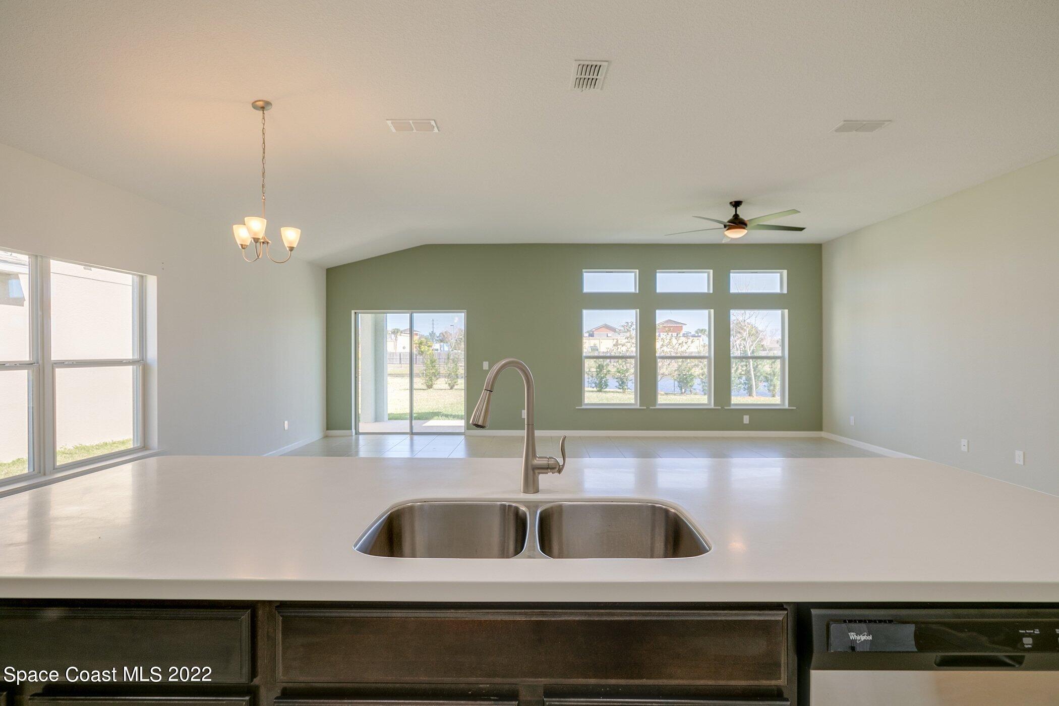 3555 Tabitha Court Melbourne, FL 32934 - Photo 11 of 30 a kitchen with a sink and a window