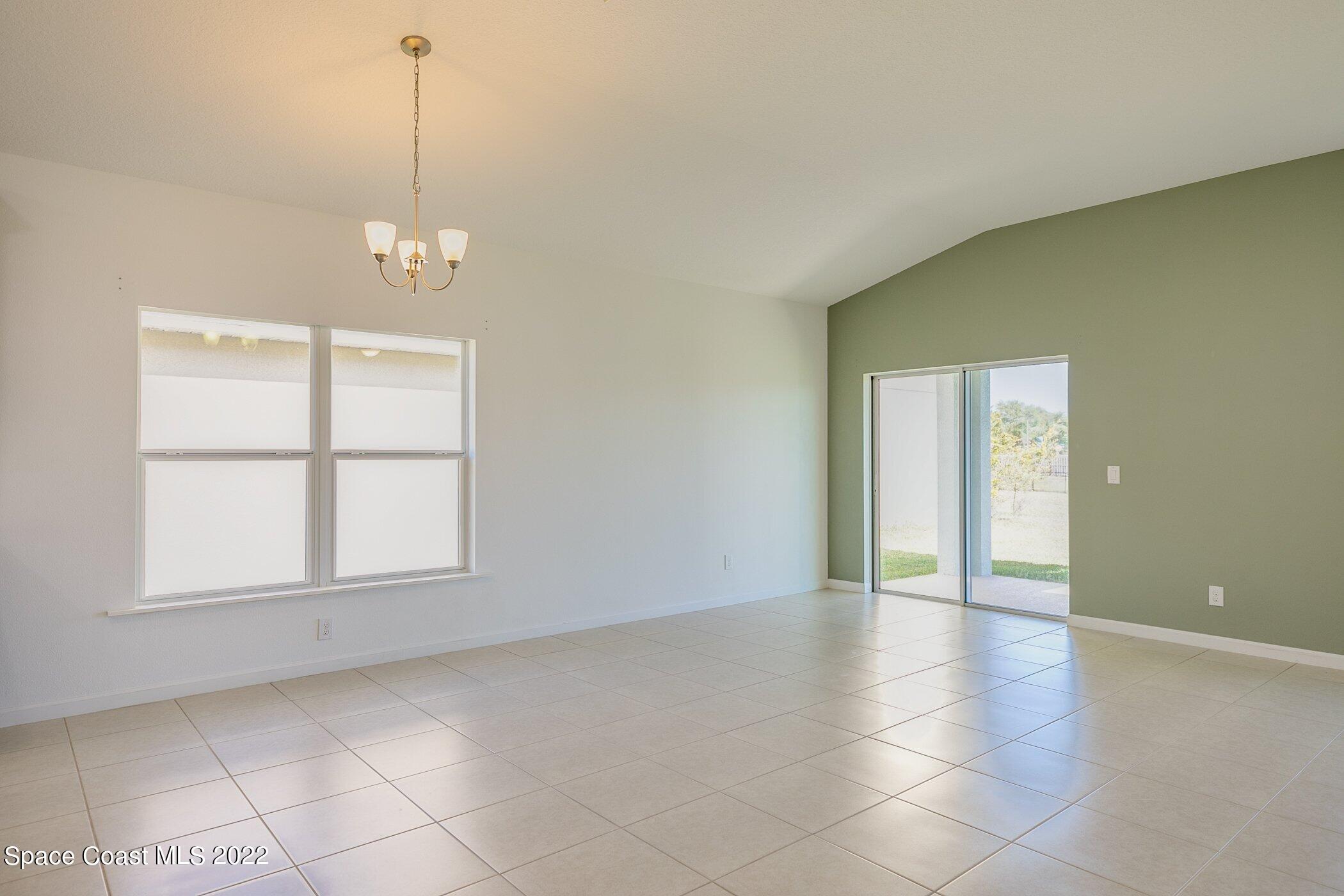 3555 Tabitha Court Melbourne, FL 32934 - Photo 14 of 30 a view of an empty room with a window