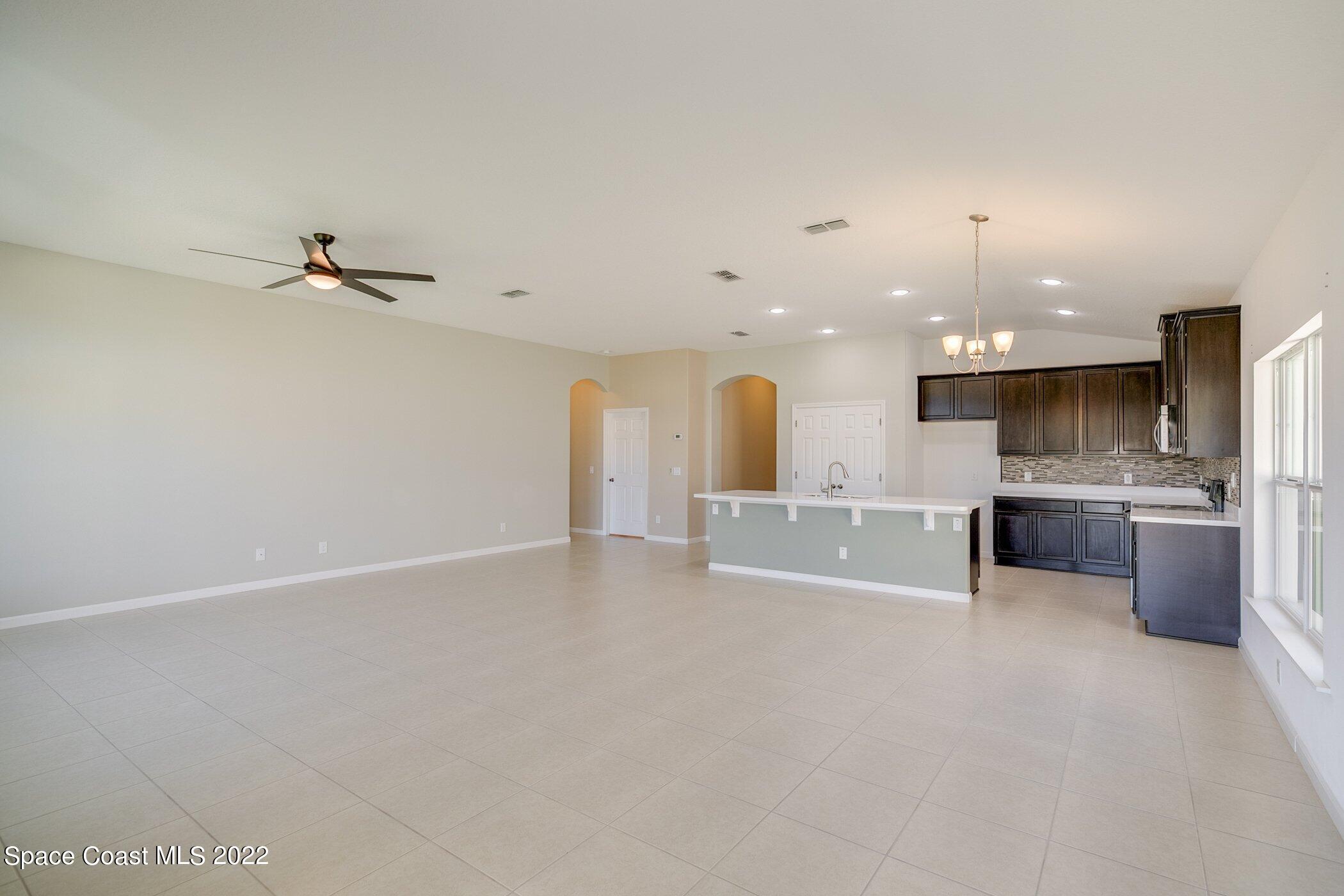 3555 Tabitha Court Melbourne, FL 32934 - Photo 16 of 30 a view of kitchen with a sink stainless steel appliances and cabinets