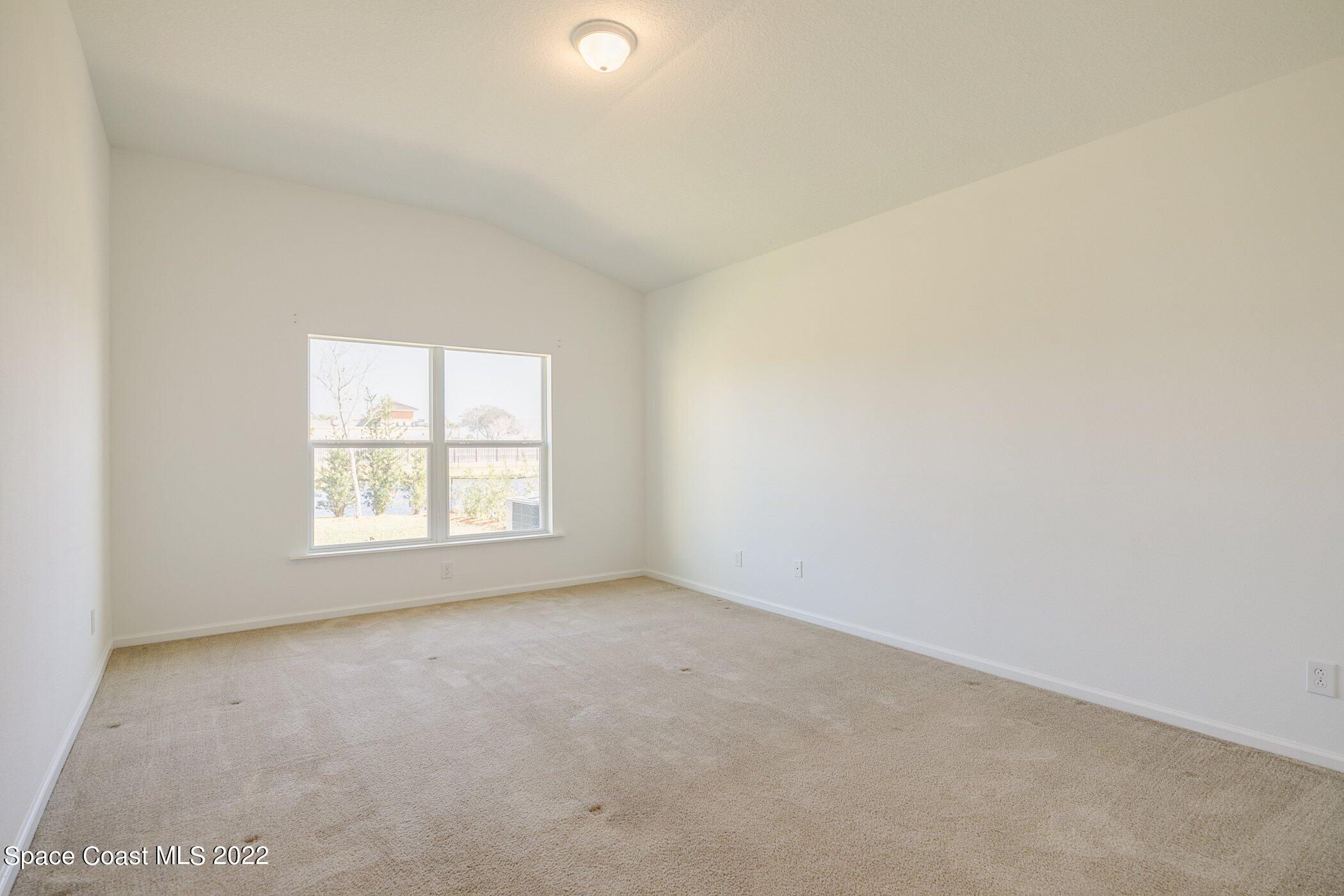 3555 Tabitha Court Melbourne, FL 32934 - Photo 18 of 30 an empty room with a window