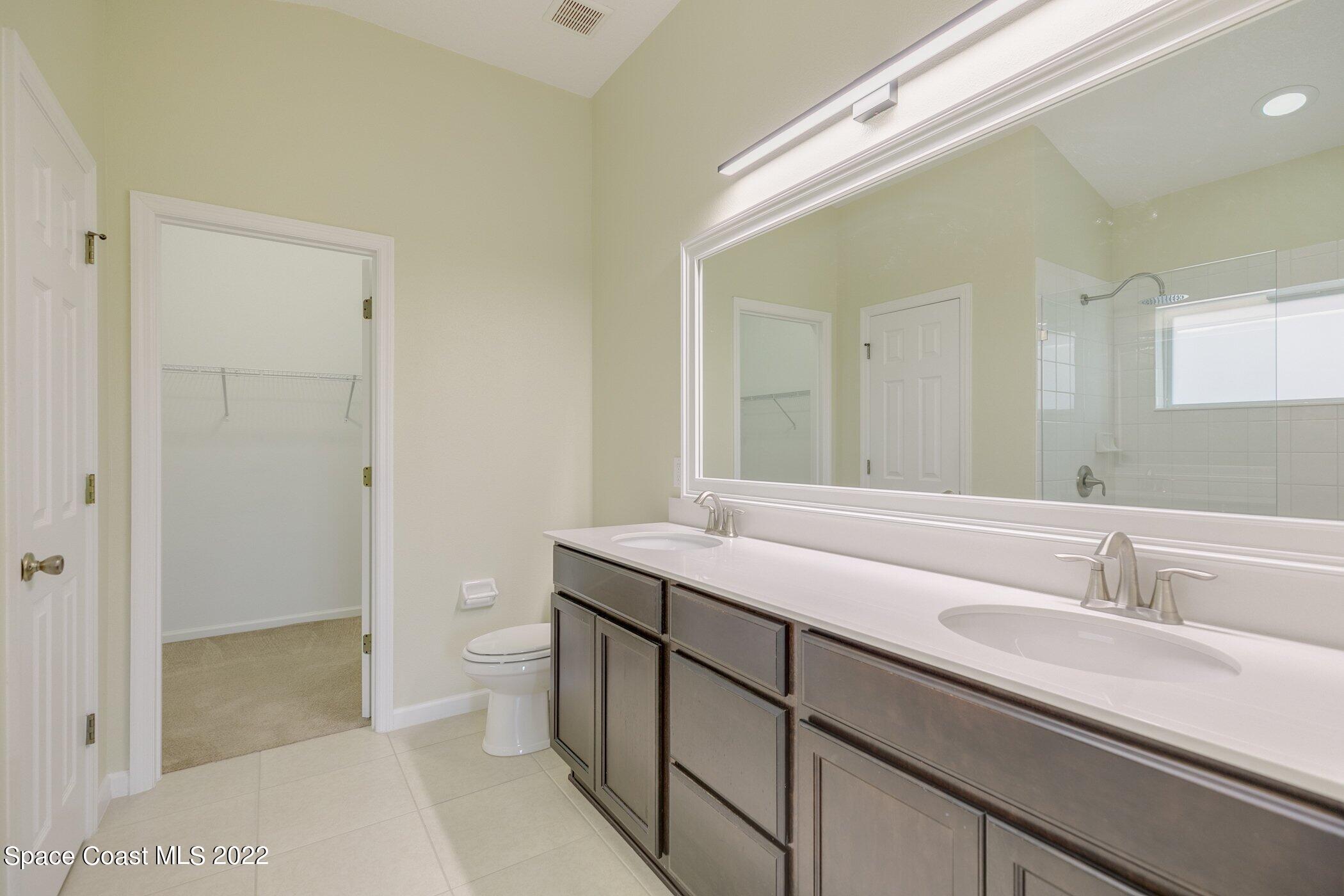 3555 Tabitha Court Melbourne, FL 32934 - Photo 20 of 30 a bathroom with a sink and a toilet