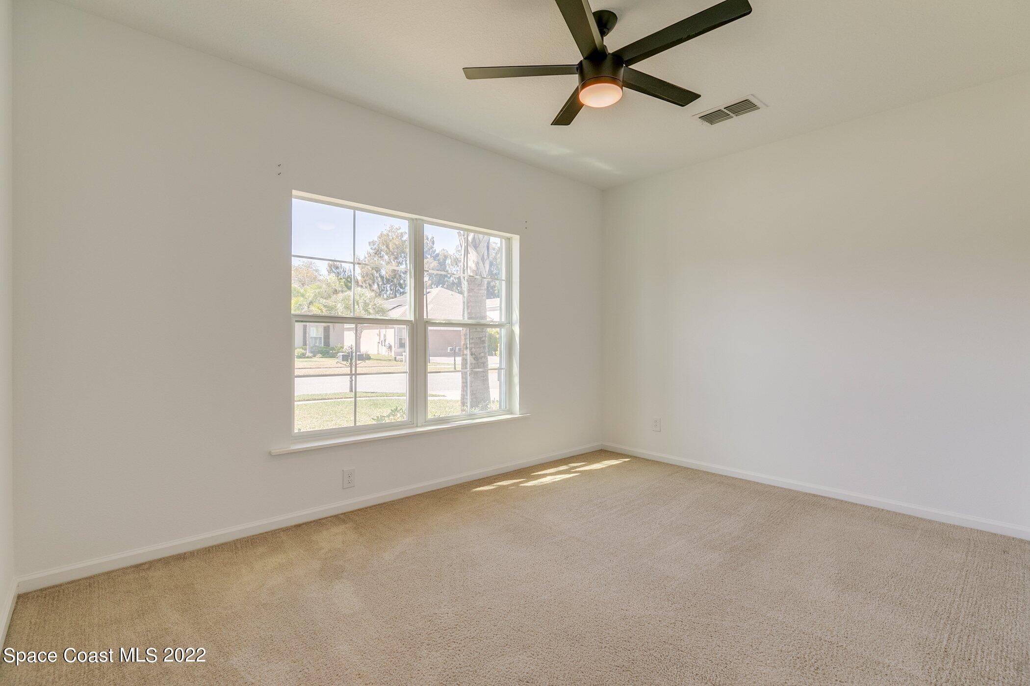 3555 Tabitha Court Melbourne, FL 32934 - Photo 22 of 30 an empty room with a window