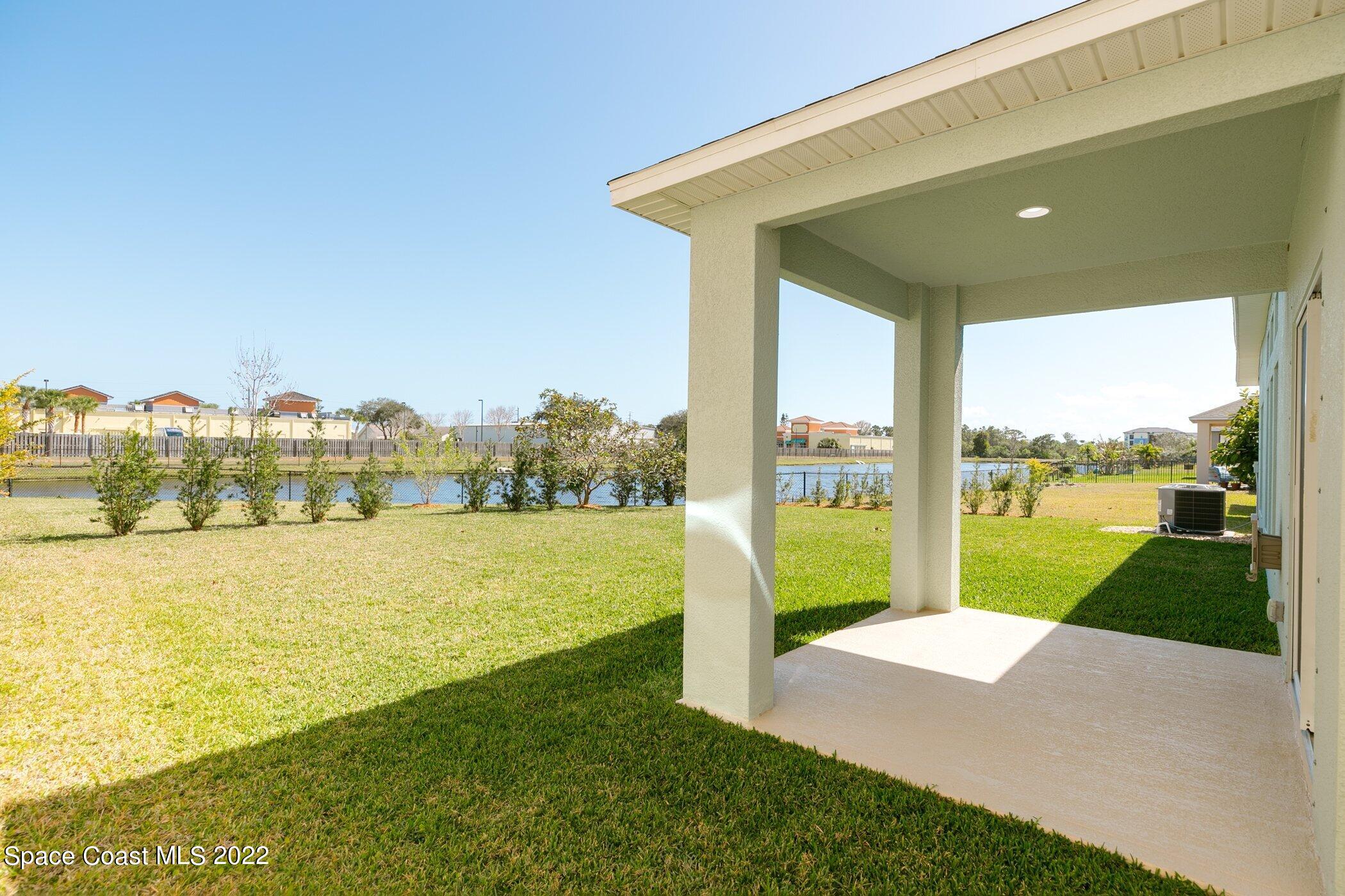 3555 Tabitha Court Melbourne, FL 32934 - Photo 25 of 30 a view of a lake with a big yard