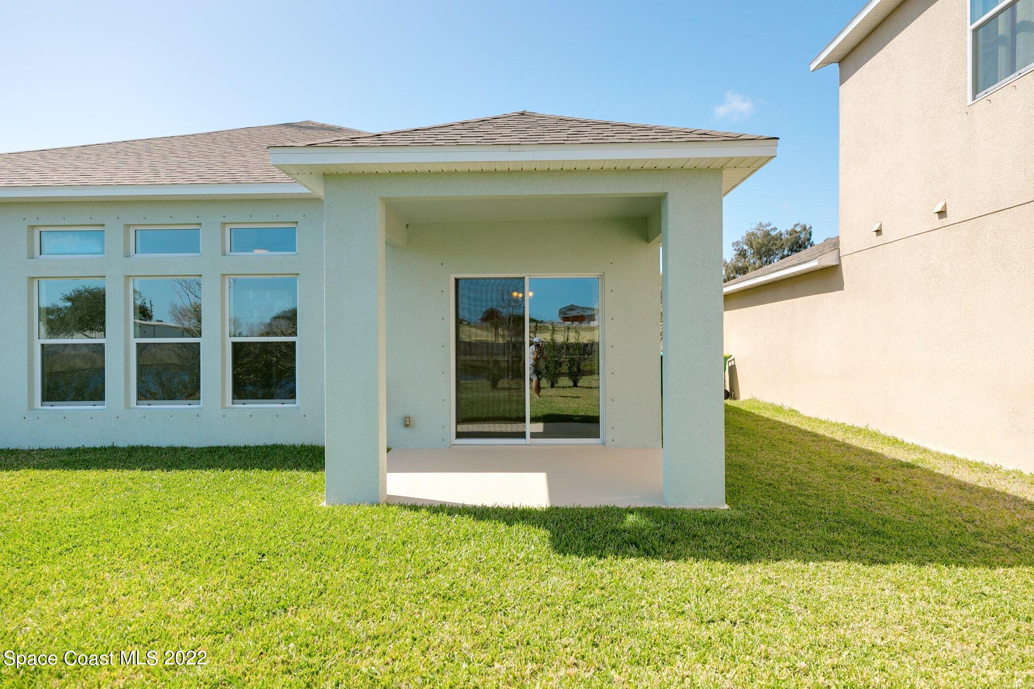 3555 Tabitha Court Melbourne, FL 32934 - Photo 26 of 30 a view of a house with backyard