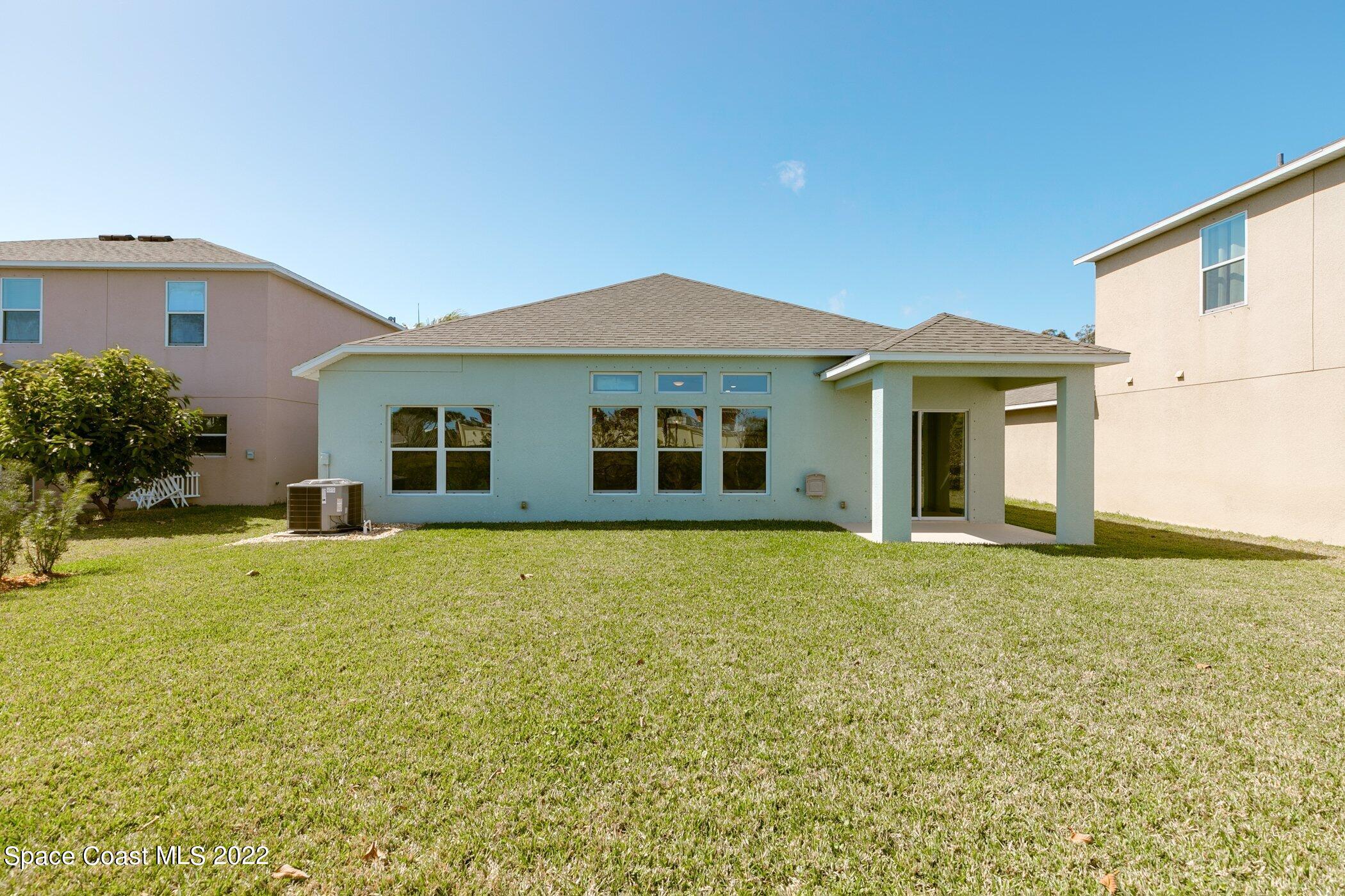 3555 Tabitha Court Melbourne, FL 32934 - Photo 27 of 30 a view of a house with backyard and garden