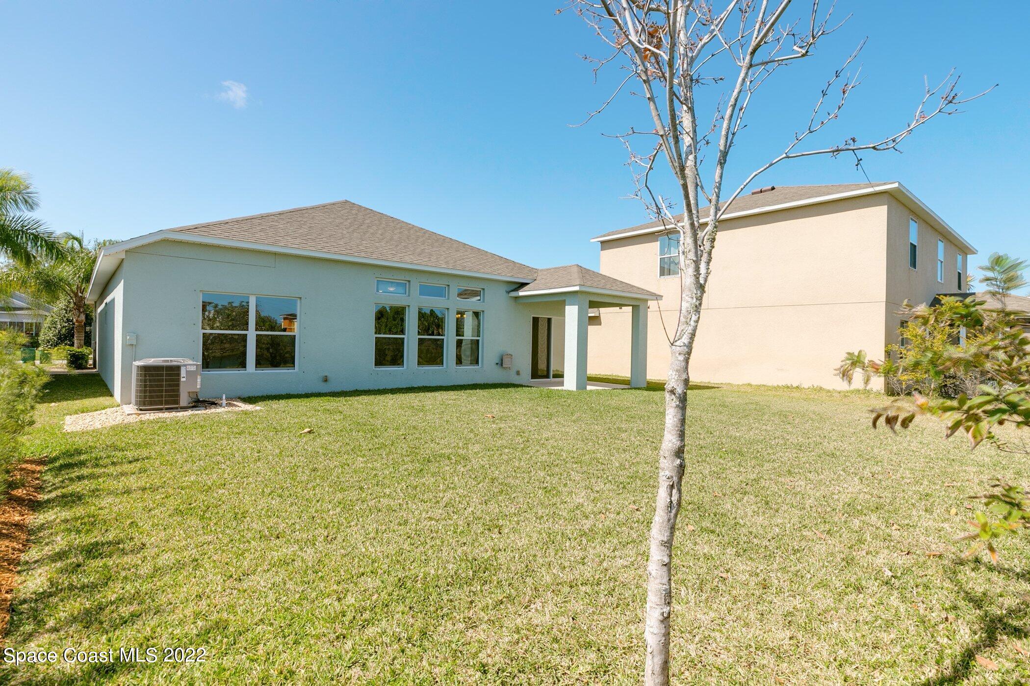 3555 Tabitha Court Melbourne, FL 32934 - Photo 28 of 30 a view of a house with a backyard