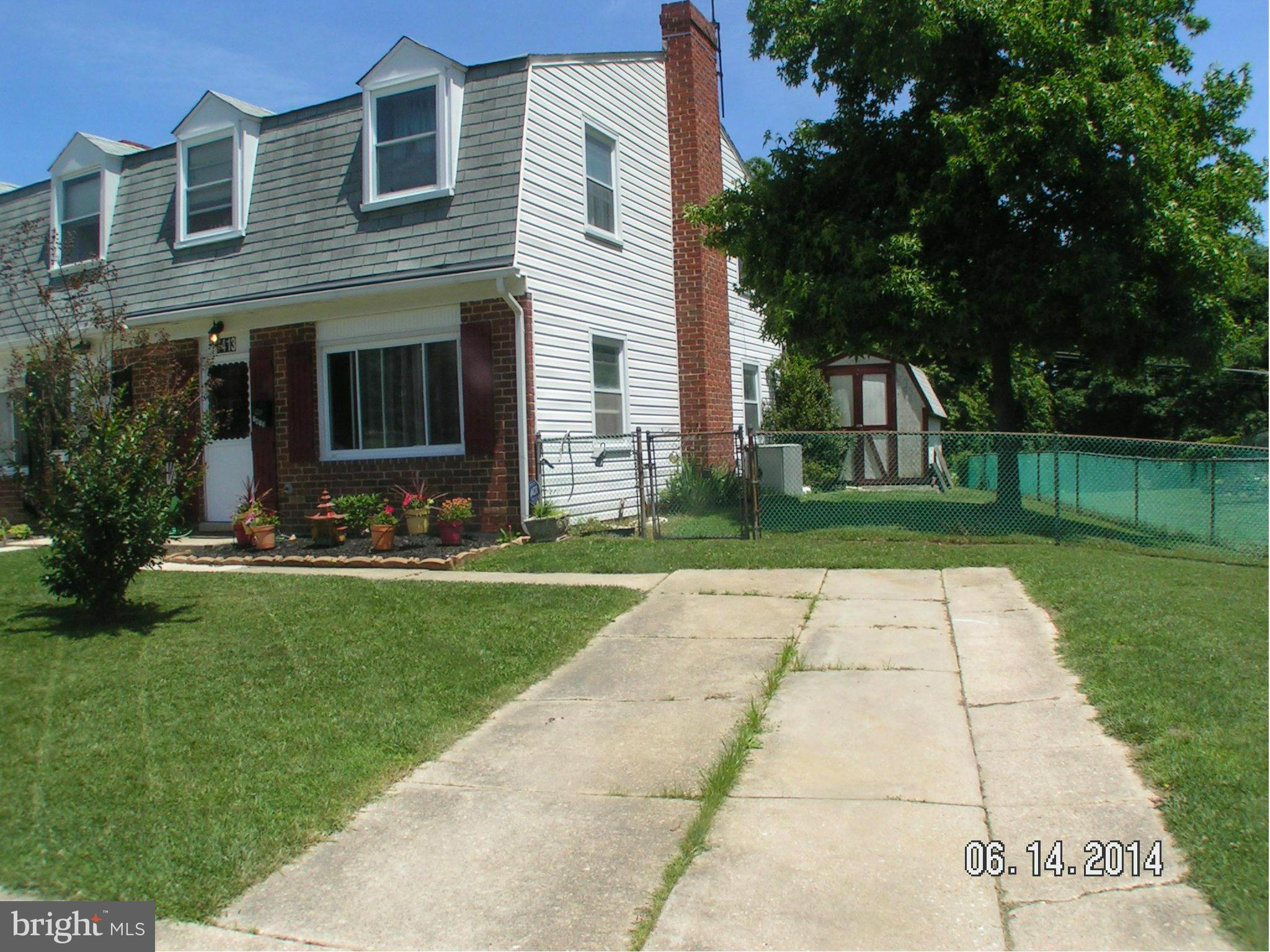 7413 Forrest Avenue Baltimore, MD 21234 - Photo 1 of 14 a front view of house with yard