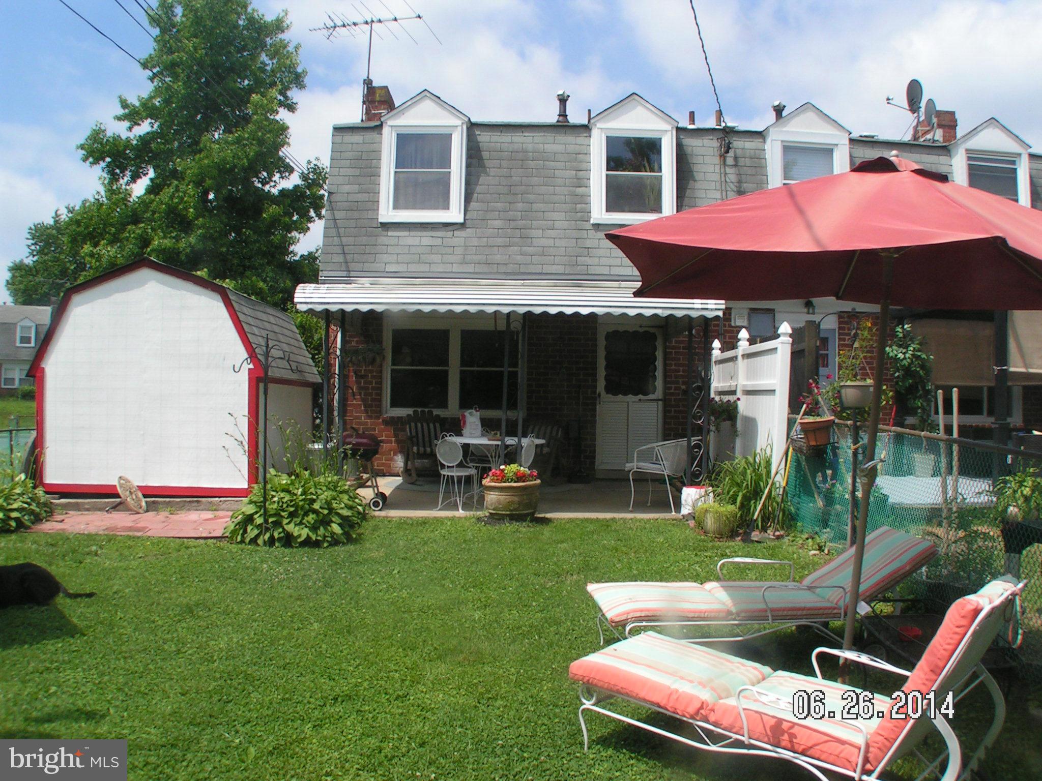 7413 Forrest Avenue Baltimore, MD 21234 - Photo 13 of 14 a view of a house with backyard sitting area and garden