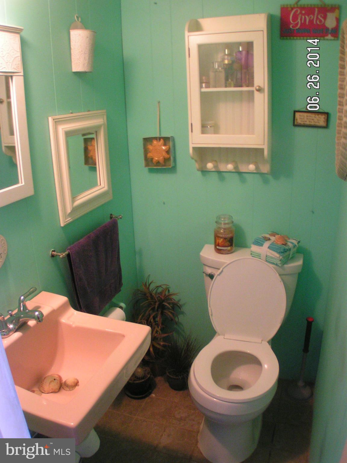 7413 Forrest Avenue Baltimore, MD 21234 - Photo 14 of 14 a bathroom with a toilet and a sink