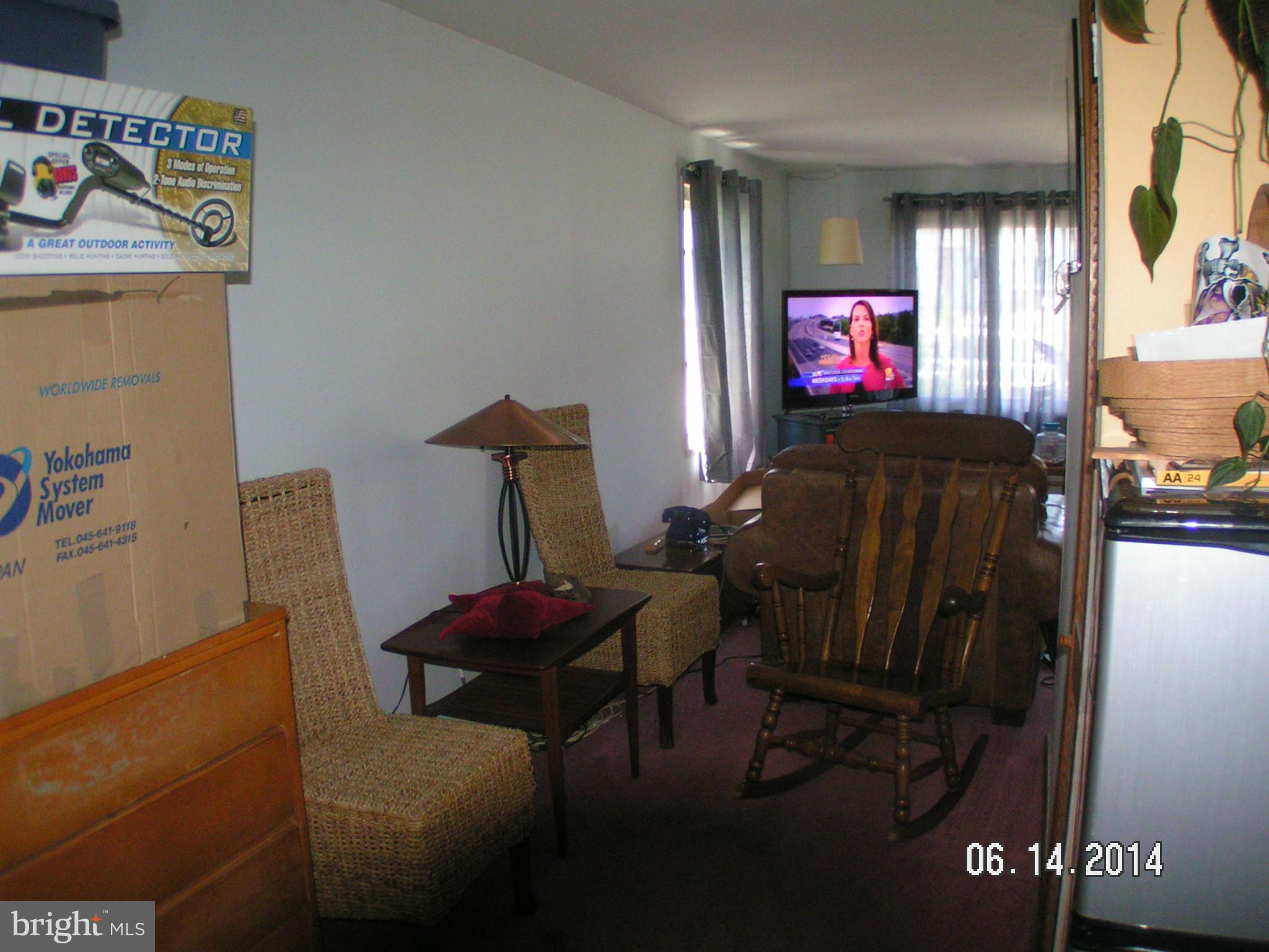 7413 Forrest Avenue Baltimore, MD 21234 - Photo 3 of 14 a living room with furniture and a flat screen tv