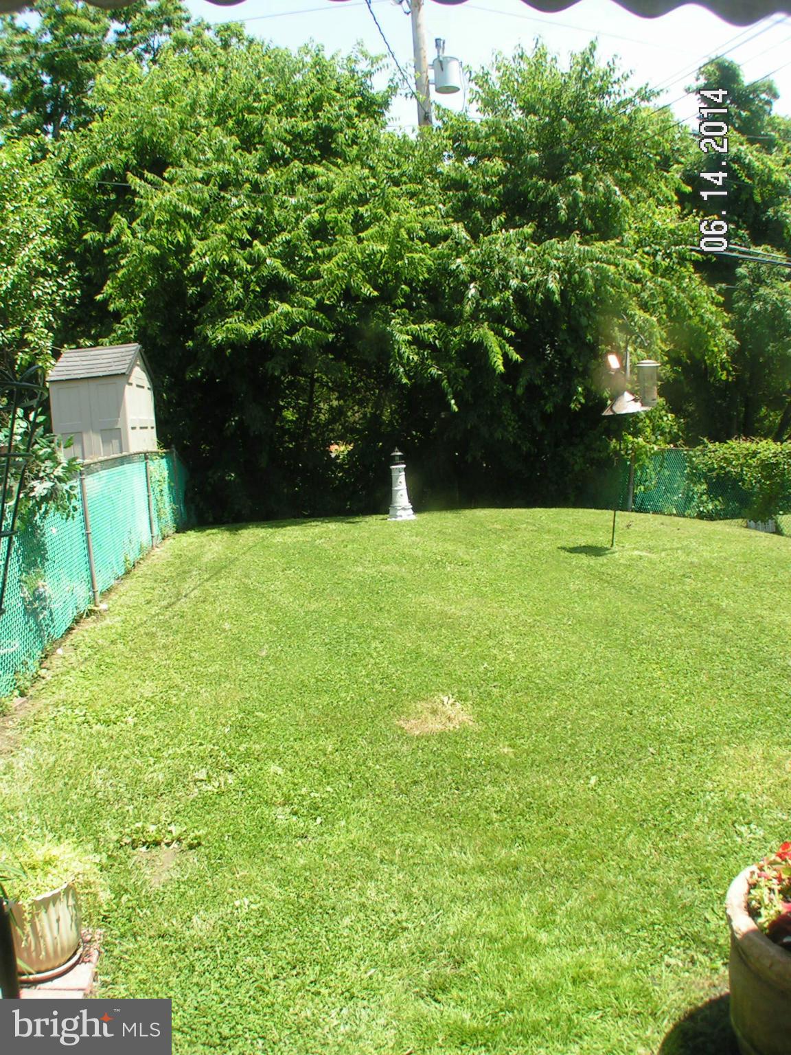 7413 Forrest Avenue Baltimore, MD 21234 - Photo 6 of 14 a view of an outdoor space and a yard