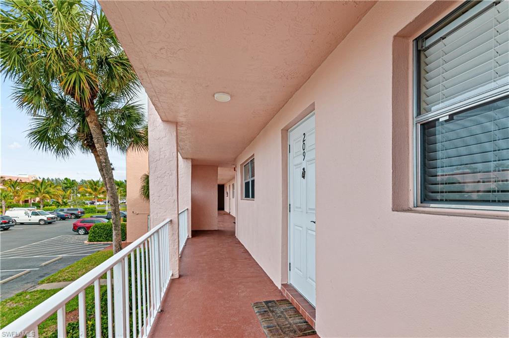 225 Turtle Lake Court, Unit 209 Naples, FL 34105 - Photo 11 of 15 a view of a porch