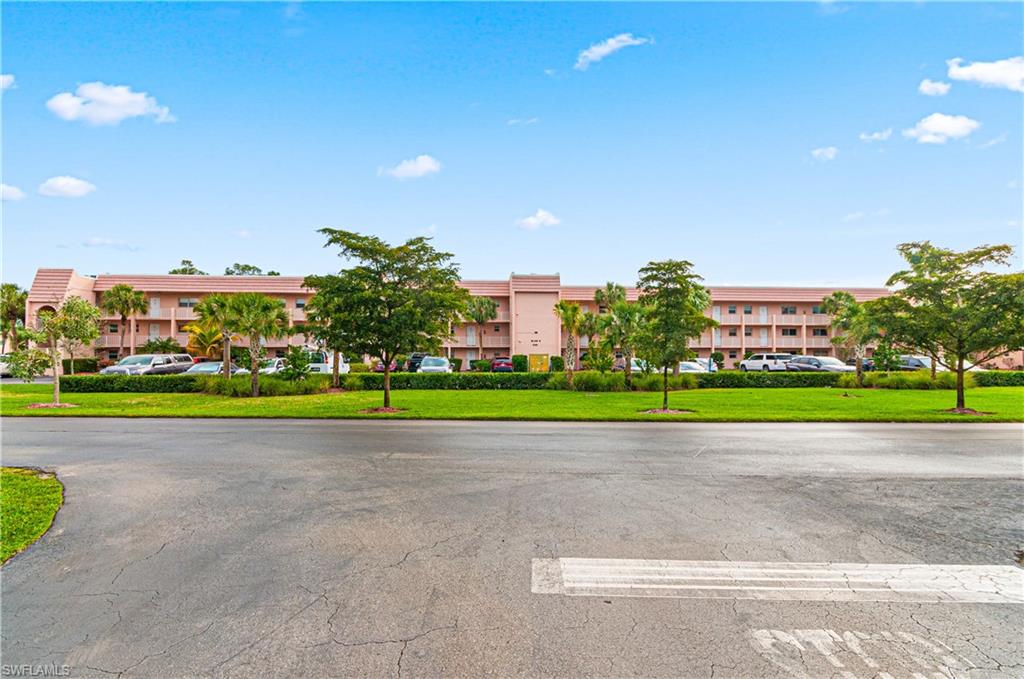 225 Turtle Lake Court, Unit 209 Naples, FL 34105 - Photo 12 of 15 a view of a golf course with a play ground