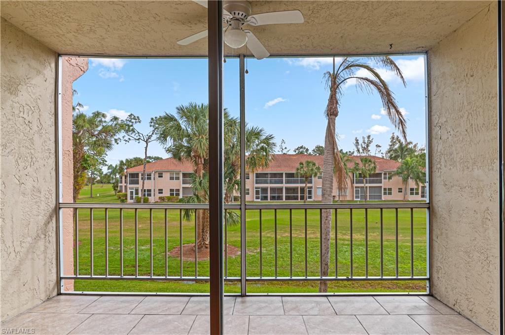 225 Turtle Lake Court, Unit 209 Naples, FL 34105 - Photo 10 of 15 a view of a city from a living room
