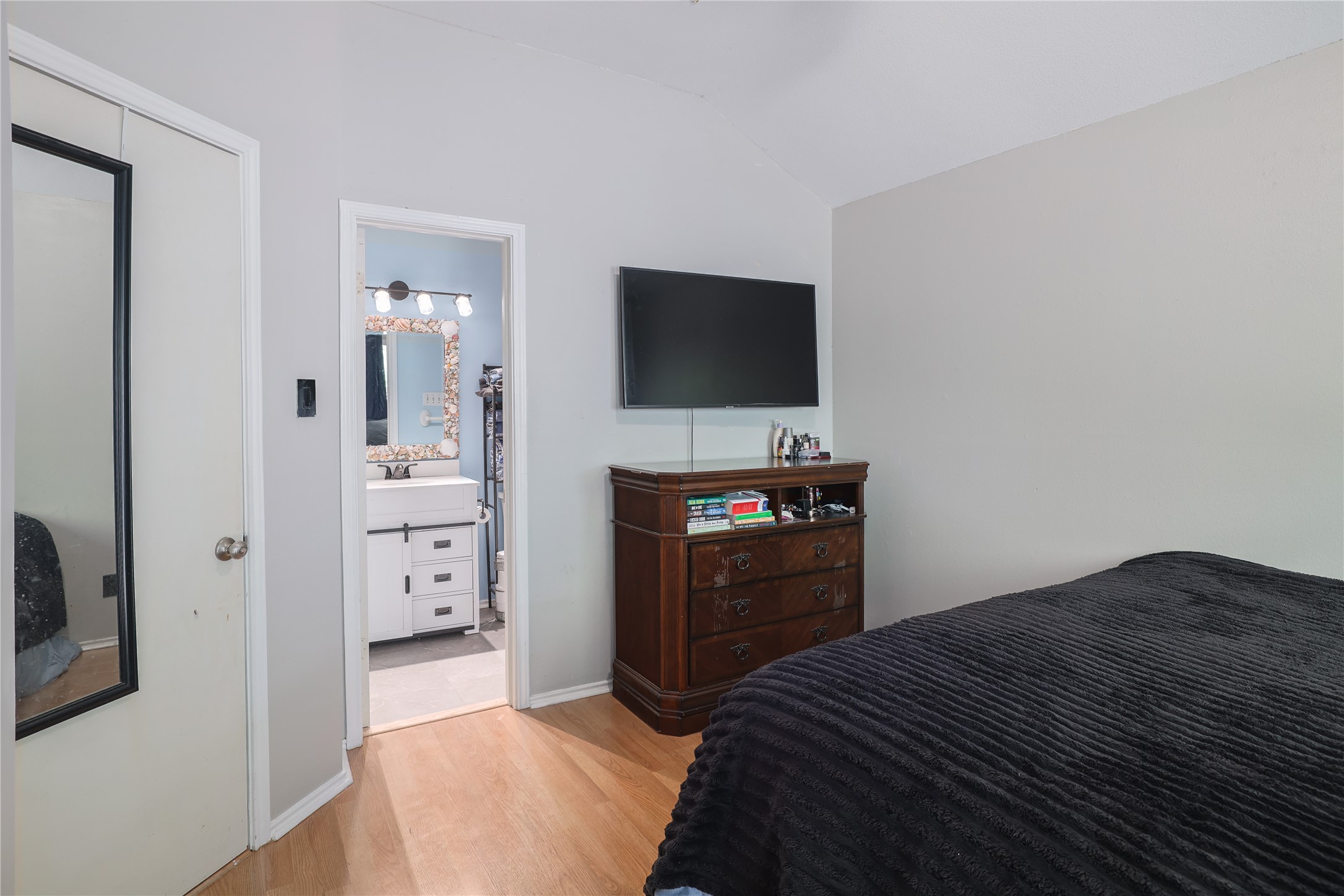 827 Topaz Lane Leander, TX 78641 - Photo 16 of 22 a bedroom with a bed and a flat screen tv