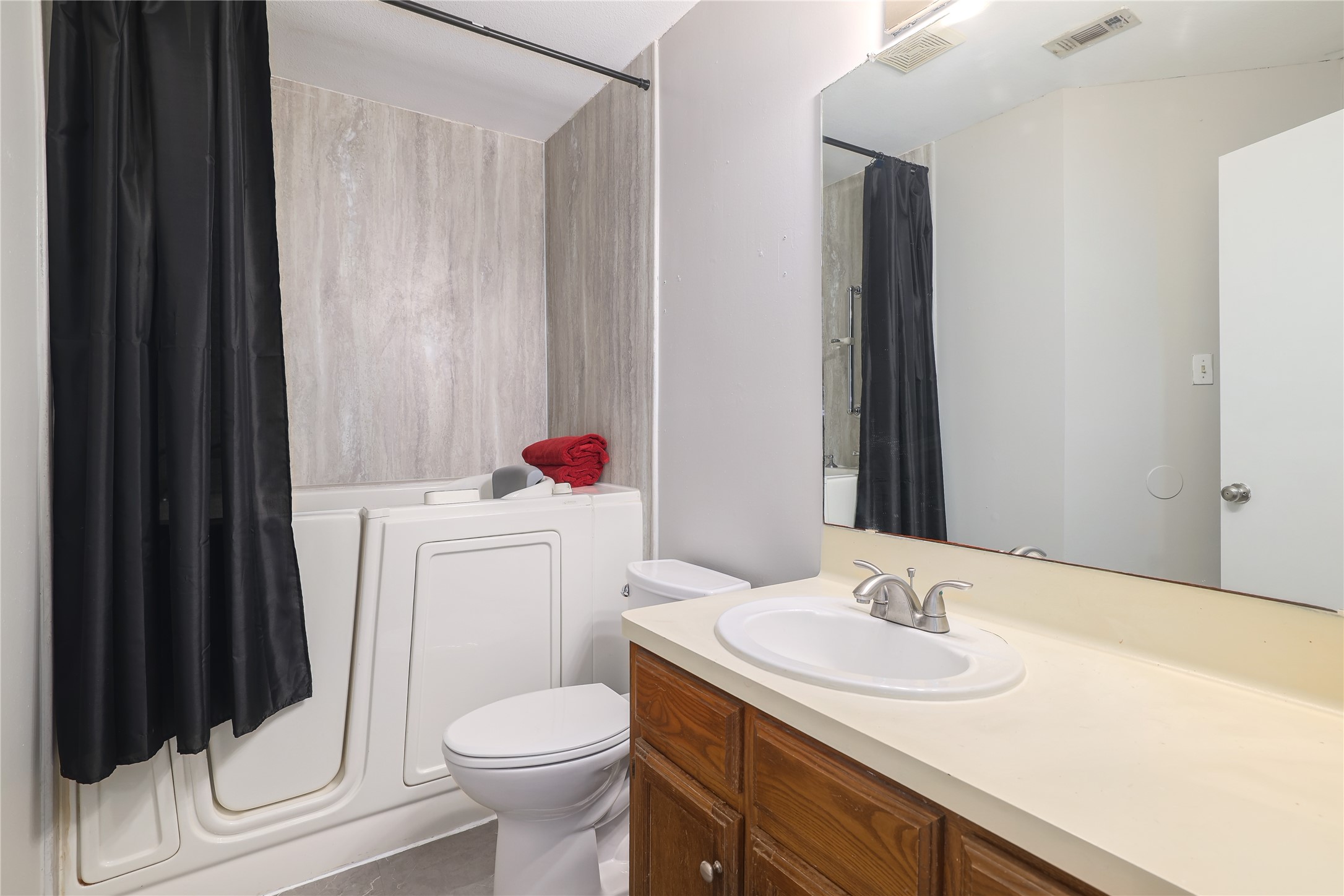827 Topaz Lane Leander, TX 78641 - Photo 19 of 22 a bathroom with a sink toilet and vanity