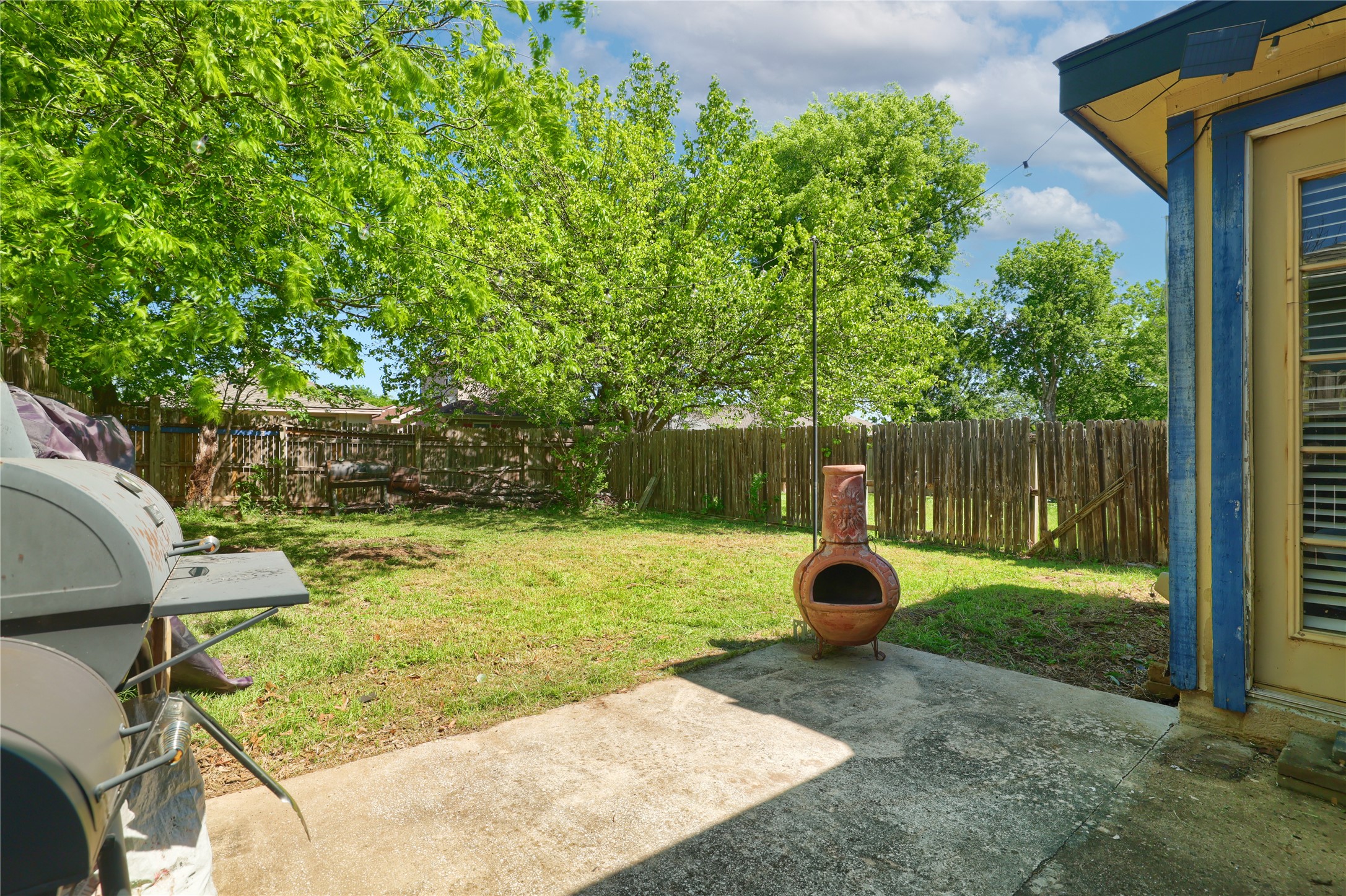 827 Topaz Lane Leander, TX 78641 - Photo 20 of 22 a backyard of a house with yard and trampoline