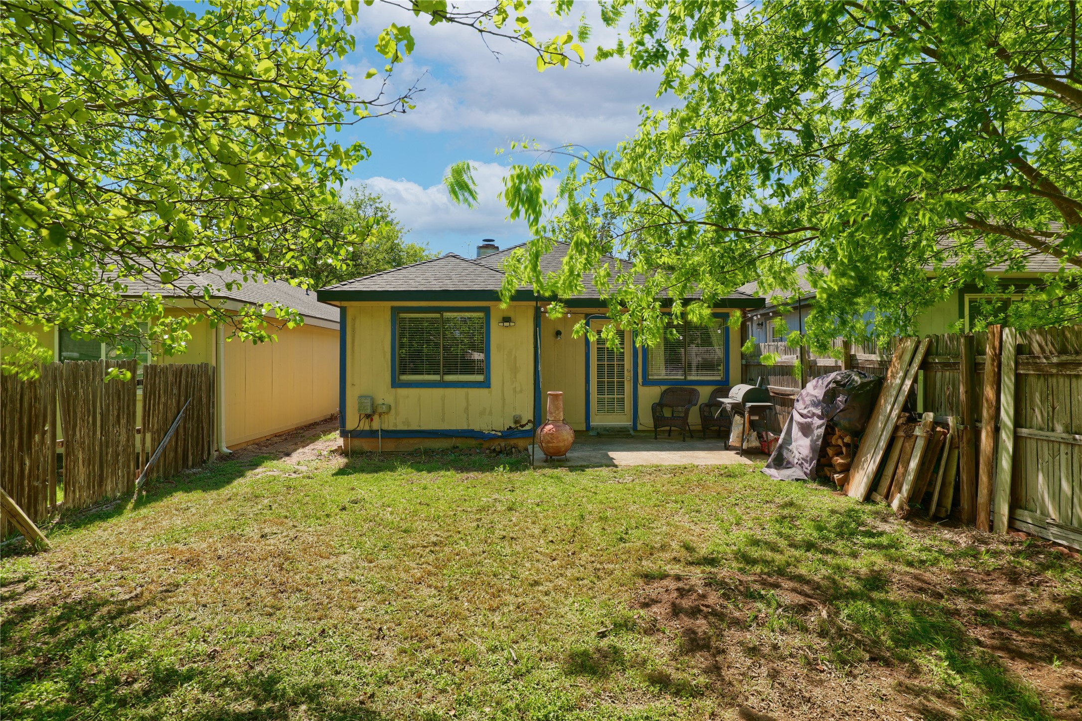 827 Topaz Lane Leander, TX 78641 - Photo 22 of 22 a backyard of a house with table and chairs