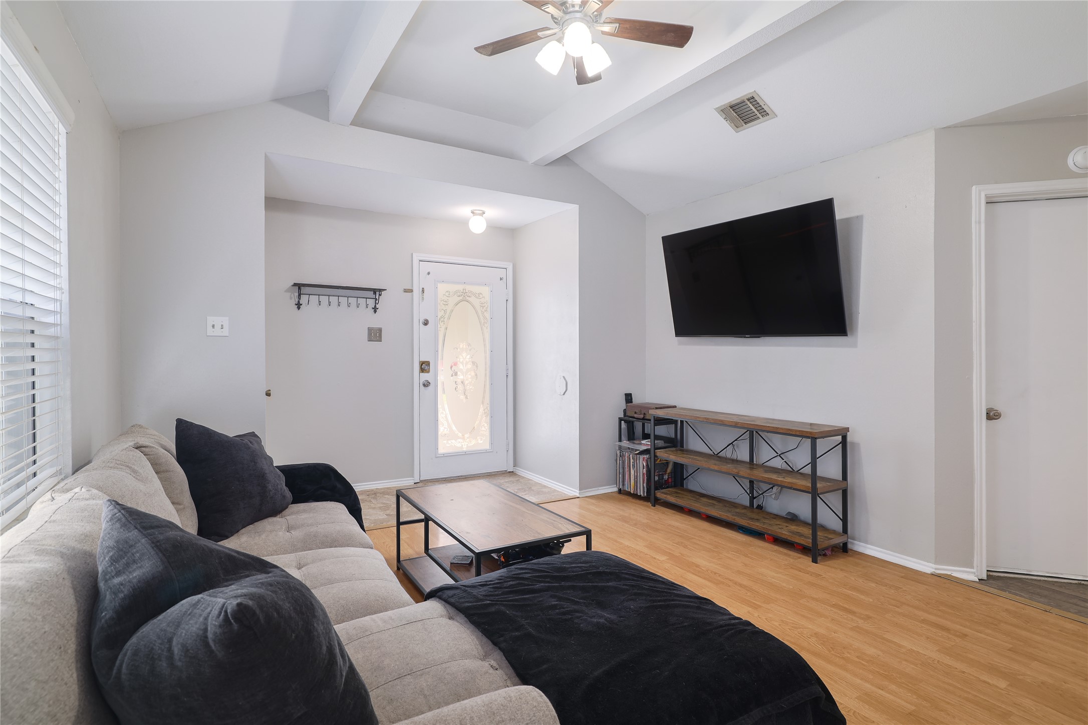 827 Topaz Lane Leander, TX 78641 - Photo 7 of 22 a bedroom with a bed window and a flat screen tv