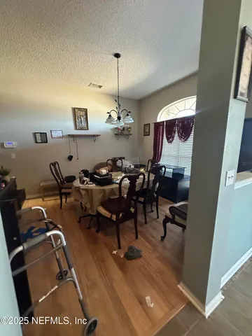 a very nice looking dining room with furniture