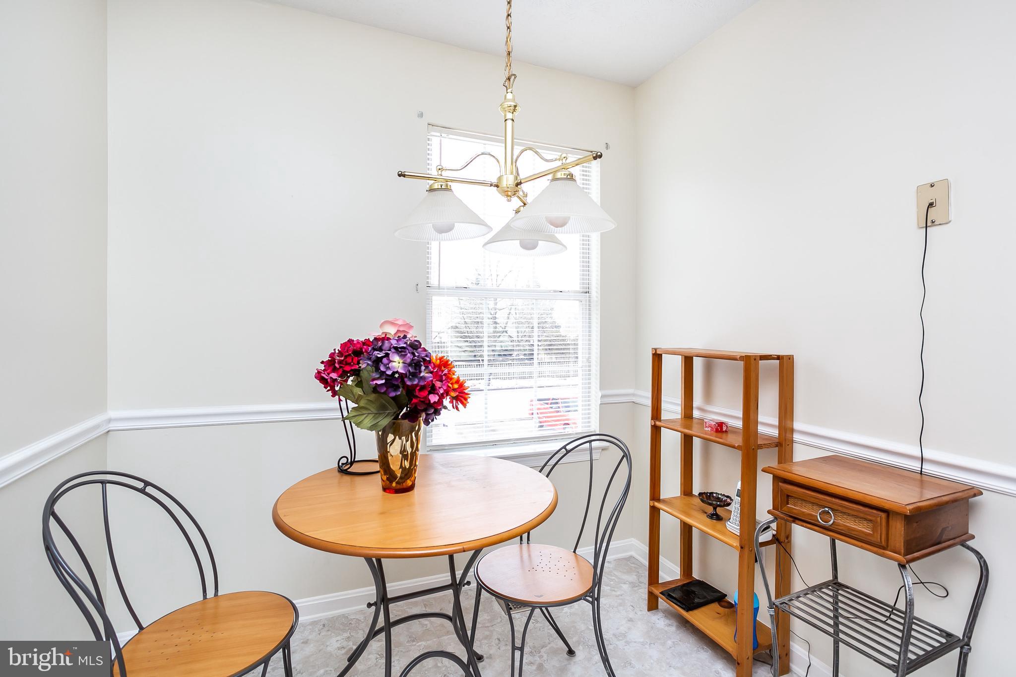 615 Nollmeyer Road Baltimore, MD 21220 - Photo 11 of 46 a dining room with furniture and window