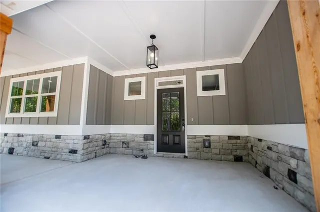 a view of entryway with wooden floor and stair