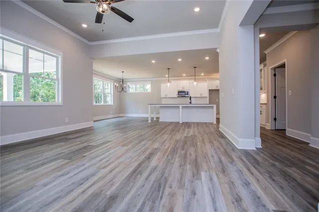 a kitchen with stainless steel appliances a stove and a microwave