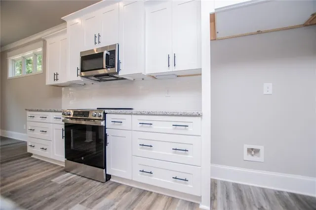 an empty room with a empty space and windows