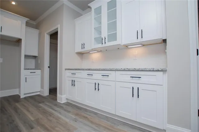 a bathroom with a double vanity sink a toilet and shower