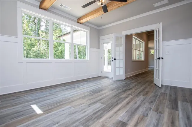 a bathroom with a granite countertop toilet sink and mirror