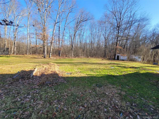 a view of a swimming pool with an outdoor space and seating area