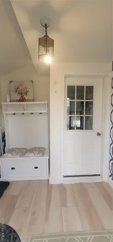 a view of a room with an empty space and window