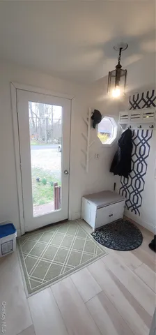 a view of a livingroom with furniture and a window