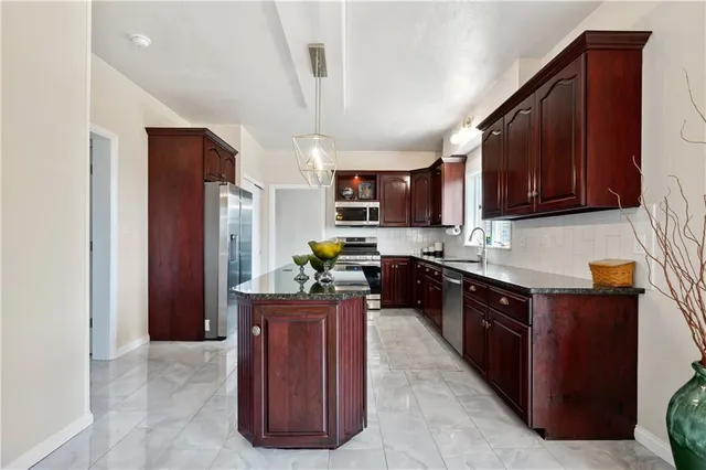 a bathroom with a sink a mirror and shower curtain