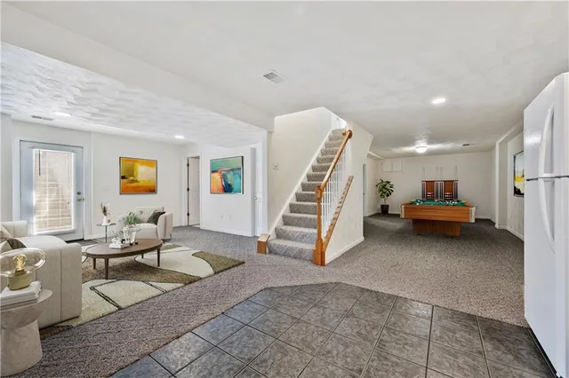 a view of an empty room with stairs