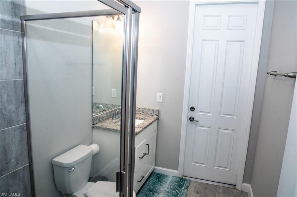 11726 Canopy Loop Fort Myers, FL 33913 - Photo 16 of 40 Bathroom featuring vanity and wood finished floors