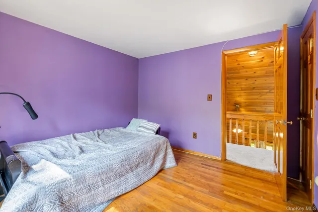 a bedroom with a bed and a view of bathroom