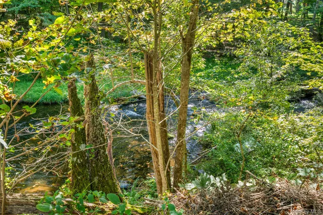 a view of balcony with wooden floor and fence