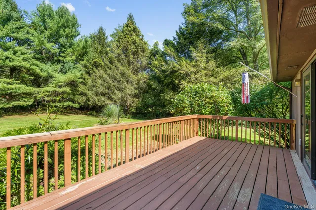 a view of a chairs on wooden deck