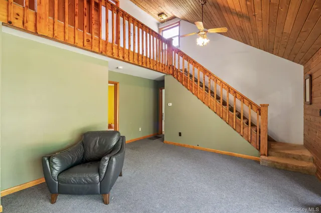 a large kitchen with stainless steel appliances granite countertop a large counter top a sink a stove and a refrigerator