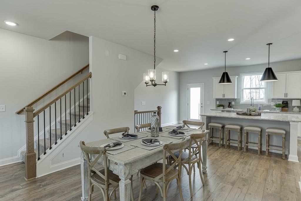 1276 Ainsworth Alley Sugar Hill, GA 30518 - Photo 12 of 56 a view of a dining room and livingroom
