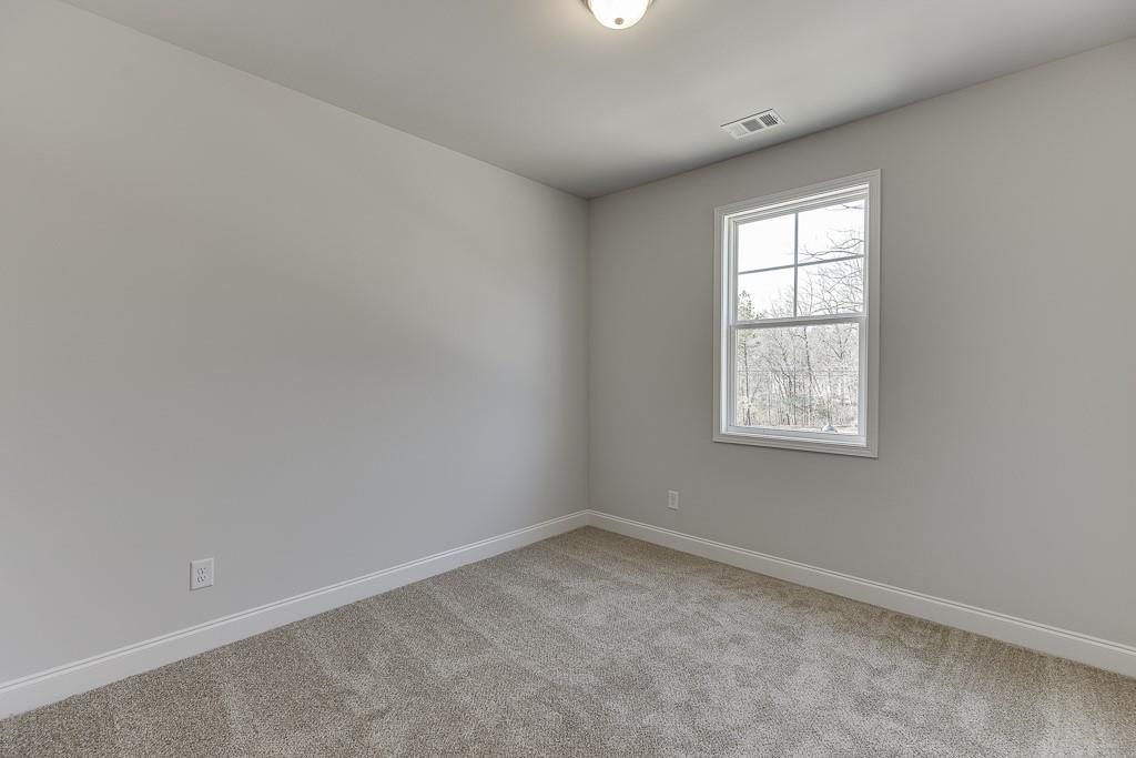 1276 Ainsworth Alley Sugar Hill, GA 30518 - Photo 29 of 56 an empty room with a window