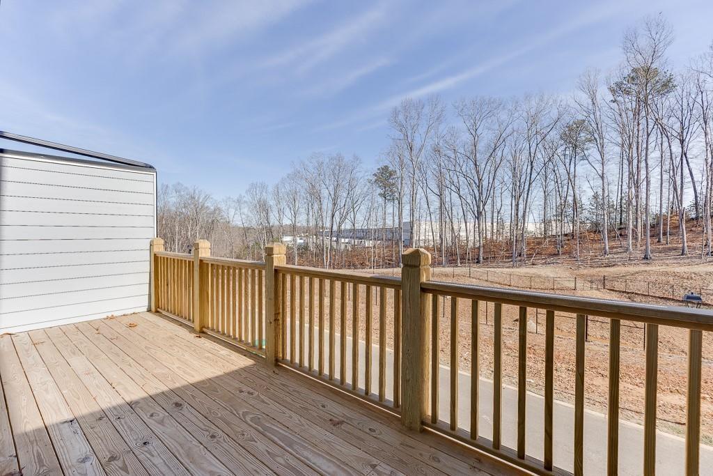 1276 Ainsworth Alley Sugar Hill, GA 30518 - Photo 35 of 56 a view of balcony with wooden floor and fence