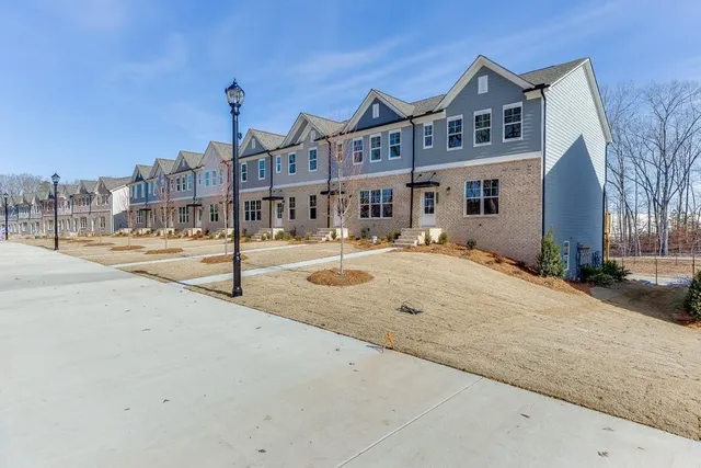 a front view of a building with garden