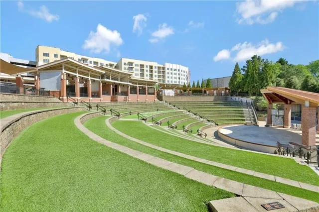 a view of a swimming pool with a garden and plants