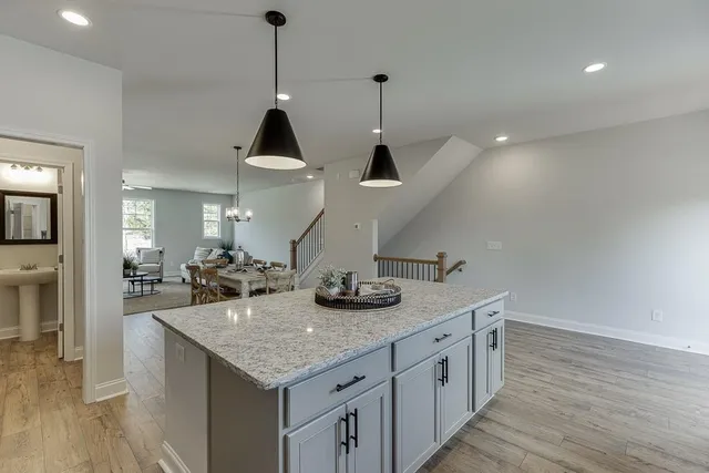 a kitchen with sink and cabinets